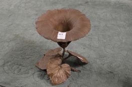 A cast metal naturalistic vase.