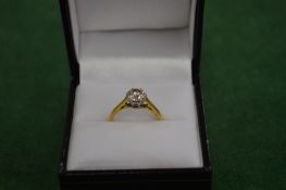 A good diamond and gold solitaire ring.