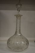 A cut glass decanter.