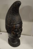 An African carved hardwood bust.