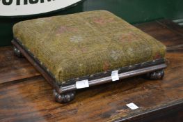 A Victorian mahogany stool.