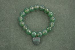 A jadeite bead bracelet.