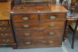 A George III mahogany chest of drawers (feet cut down).