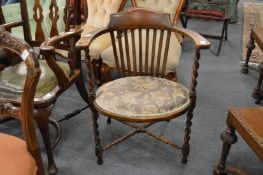 A small mahogany armchair.