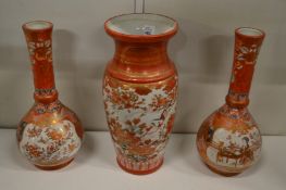 A Japanese Kutani vase and a pair of similar bottle vases.