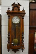 A Victorian walnut Vienna style regulator wall clock.