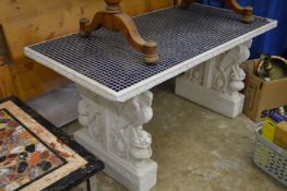 A good large painted stone pedestal table inset with blue mosaic tiles.