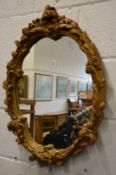 A gilt plaster framed mirror.