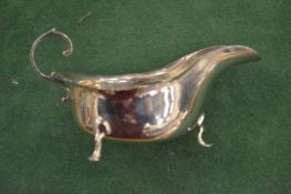 A silver sauce boat.