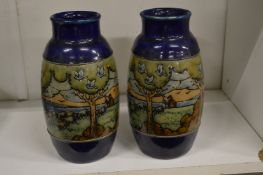 A pair of continental landscape vases.