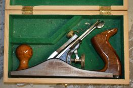 A boxed woodworking plane.