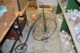 A large wrought iron model of a penny farthing.