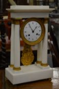 A good white marble and ormolu Portico mantle clock.