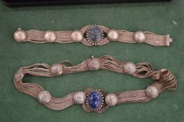 A silver and lapis necklace.