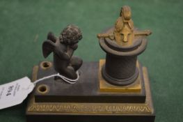 A small bronze Empire revival inkwell.