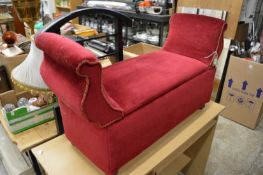 An upholstered ottoman window seat.