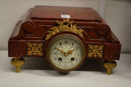 A 19th century French rouge marble and ormolu mounted clock.