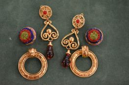 Three pairs of designer earrings.