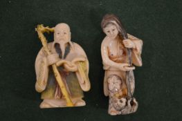 Two carved Japanese figures.