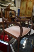An Edwardian inlaid mahogany armchair.