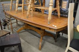 A modern pine extending kitchen table.