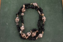 An Islamic jet and mother-of-pearl necklace.