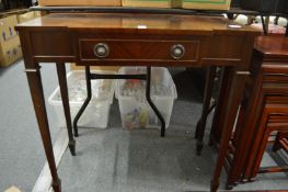 A small mahogany side table.