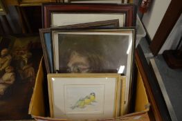 A box of paintings and prints.