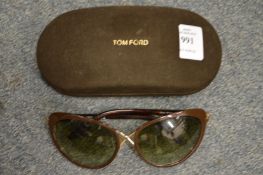 A pair of Tom Ford sunglasses in original case.