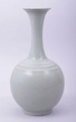 A CHINESE CELADON RU WARE BOTTLE VASE, 27cm high.