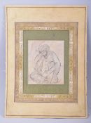 AN ISLAMIC INK DRAWING ON PAPER, depicting a seated figure, with calligraphy and gilt highlights,