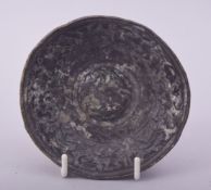 A RARE EARLY ISLAMIC OR POSSIBLY ROMAN BRONZE BOWL, the centre depicting a bird of prey surrounded