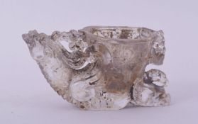 A CHINESE CUT GLASS LIBATION CUP, the handle formed as a beast, 14cm long.