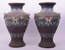 A LARGE PAIR OF CHINESE CHAMPLEVE ENAMEL BRONZE VASES with twin ring handles, the body of each