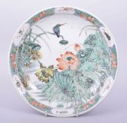 A CHINESE KANGXI STYLE FAMILLE VERTE PORCELAIN DISH, painted with native flora, the base with six