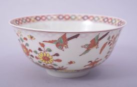 A CHINESE WUCAI PORCELAIN BOWL, the exterior painted with birds and native flora, with a six