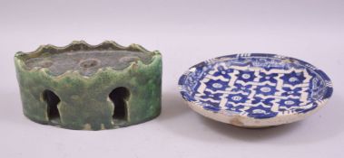 A MOROCCAN GREEN GLAZED POTTERY INKWELL, together with a blue and white glazed pottery dish, inkwell