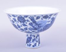 A CHINESE BLUE AND WHITE PORCELAIN STEM CUP, the bowl painted with kylin and foliate decoration, the
