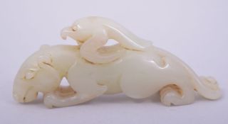 A CHINESE CARVED JADE MYTHICAL BEAST, 10cm long.
