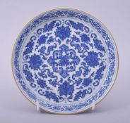 A CHINESE BLUE AND WHITE PORCELAIN DISH decorated with lotus, the dish with gilt rim and turquoise