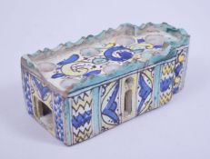 AN EARLY MOROCCAN POTTERY INKWELL, 16.5cm wide.