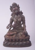 A TIBETAN DECORATIVE BRONZE SEATED DEITY, with fitted box, bronze 16cm high.