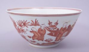 A CHINESE IRON RED AND WHITE PORCELAIN BOWL, the exterior painted with many figures in a garden