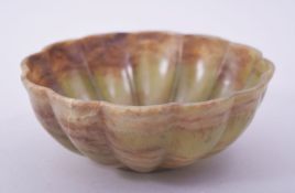 A CHINESE RIBBED JADEITE BOWL, 15cm diameter.
