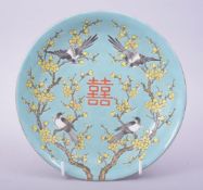 A CHINESE TURQUOISE GROUND PORCELAIN DISH, painted with birds and blossom, six character mark to