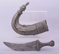 AN EARLY ISLAMIC ARAB OMANI RHINO HORN HILTED SILVER JAMBIYA DAGGER, 30cm long overall.