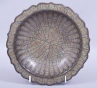 A CHINESE GE WARE PETAL FORM DISH, 20.5cm diameter.