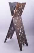 AN ISLAMIC CARVED WOOD AND ABALONE INLAID QURAN STAND, 78cm long (closed).
