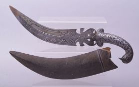 AN UNUSUAL 19TH CENTURY INDIAN CHISELLED STEEL DAGGER, with bird form handle and zoomorphic blade in