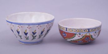 TWO TURKISH KUTAHYA POTTERY BOWLS, each decorated with various floral motifs, 13cm diameter and 11.